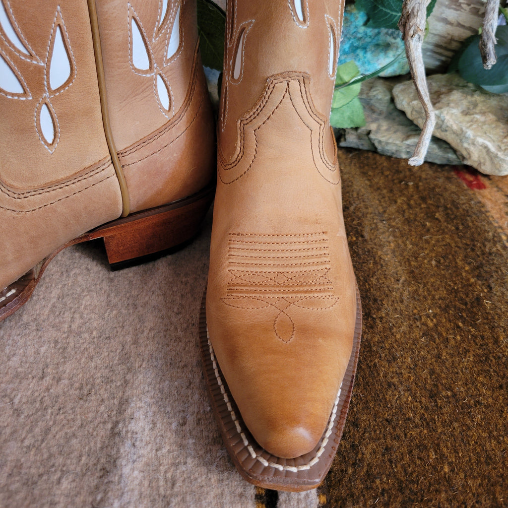 A close-up of the snip toe and intricate stitching.