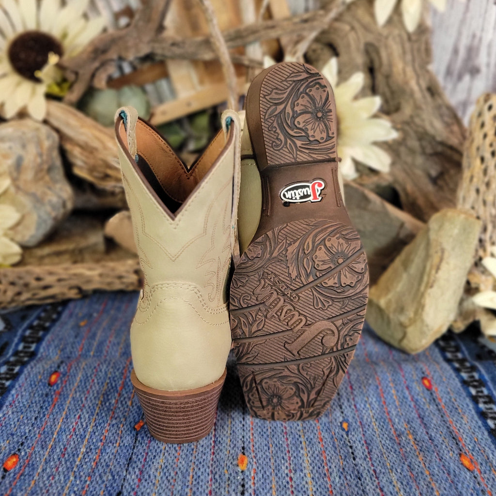 The boots feature a rubber sole with floral details.