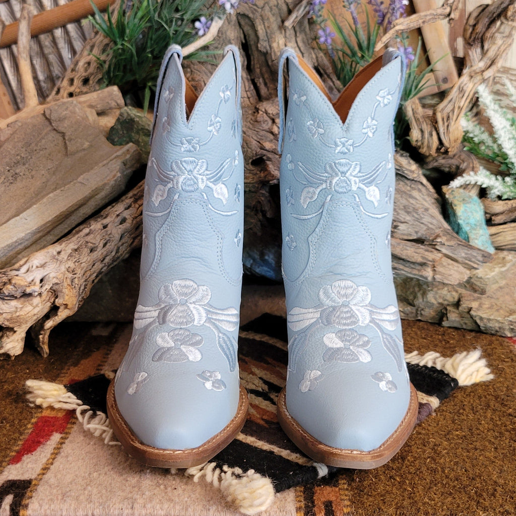 Blue ankle boots with a snip toe and floral embroidery.