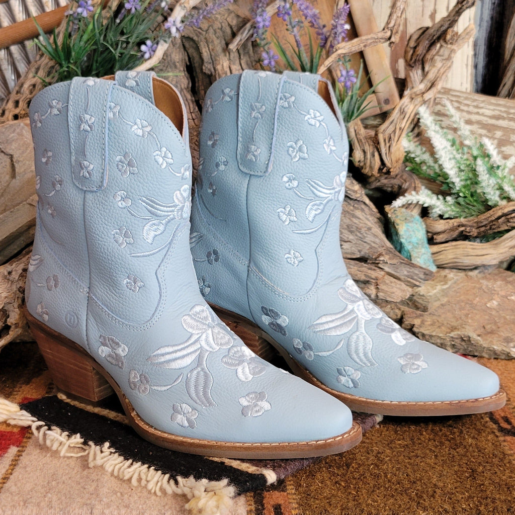 Blue ankle boots with a snip toe and floral embroidery.