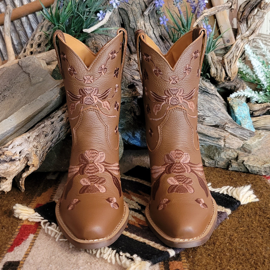 Brown ankle boots with a snip toe and floral embroidery.