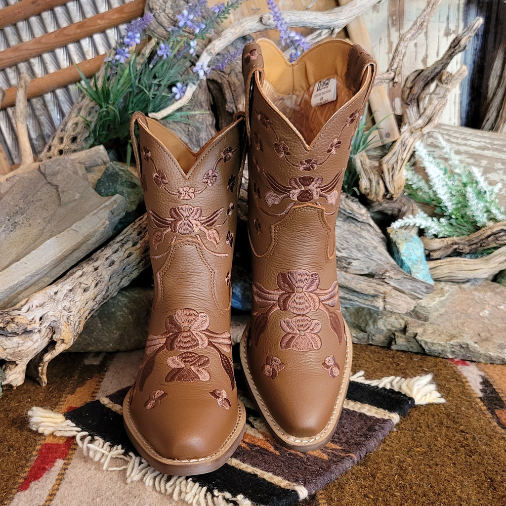 Brown ankle boots with a snip toe and floral embroidery.