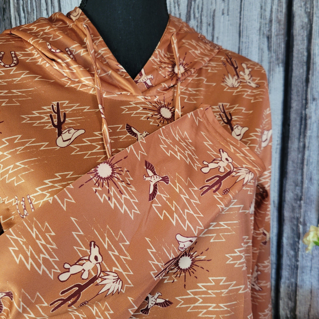 A close-up of the western patterns on the sleeve.