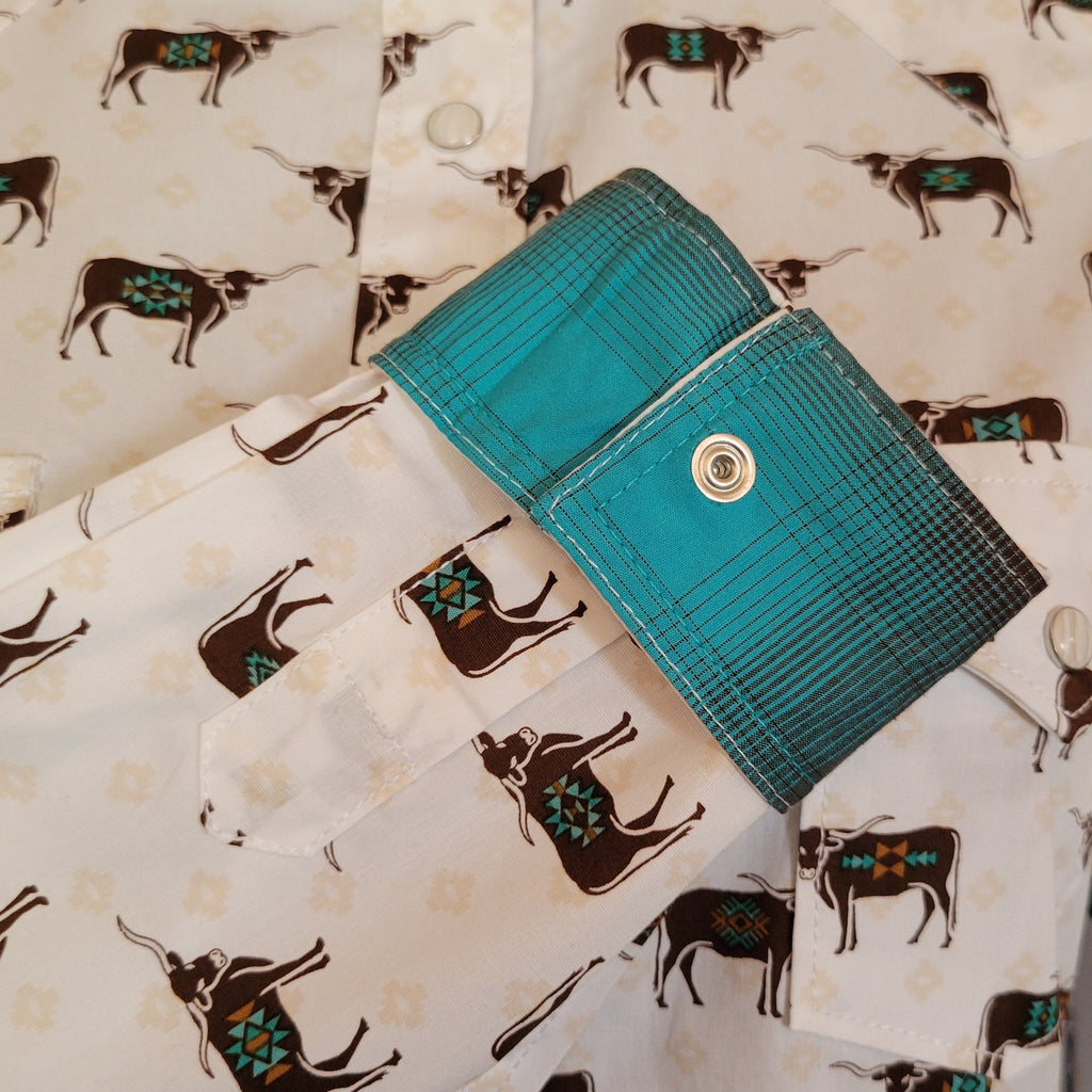 Close up of the bull patterns with turquoise accents inside sleeve.