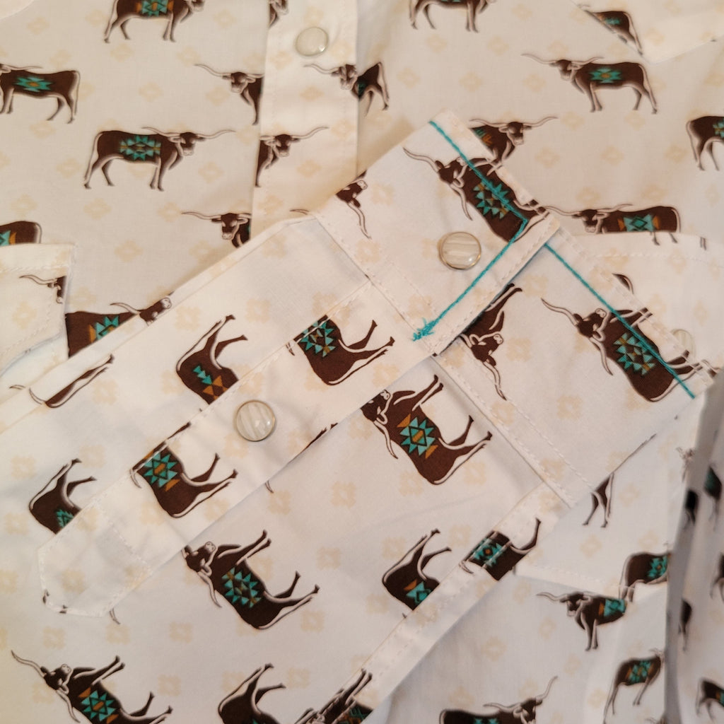 Close up of the bull patterns with turquoise accents on the sleeve.
