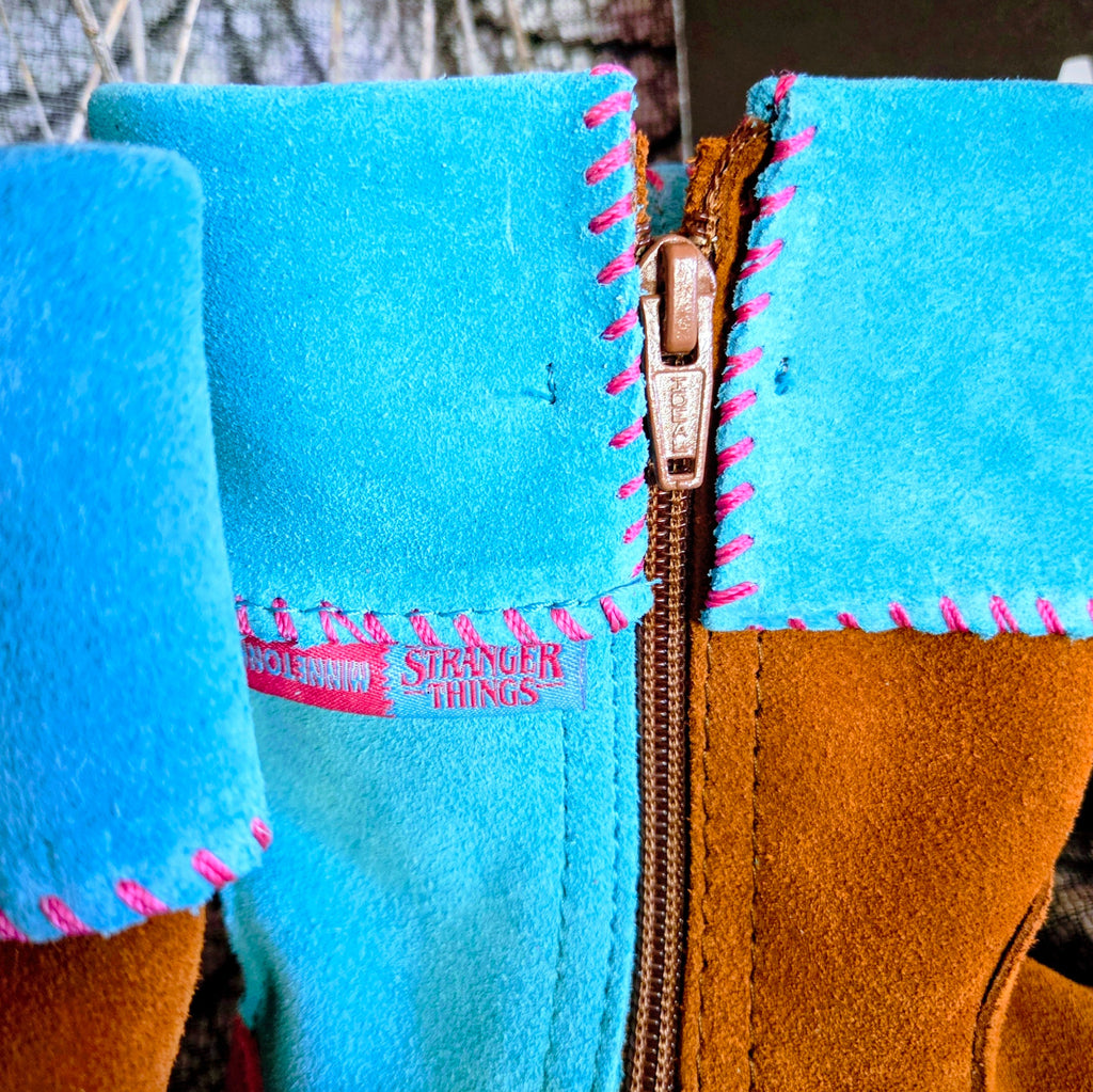 Women's Minnetonka Holly Wheeler Stranger Things moccasins in soft turquoise suede cuffs and tan fringe boots.