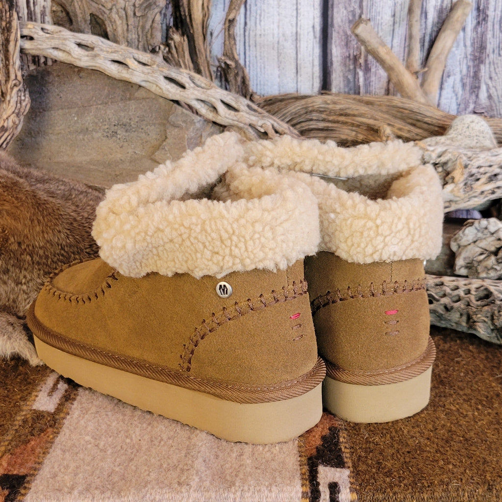 Pair of tan moccasin boots with Berber lining and EVA outsole.
