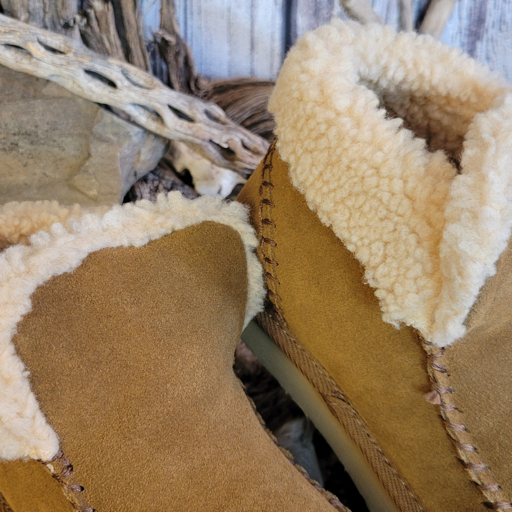 Pair of tan moccasin boots with Berber lining and EVA outsole.