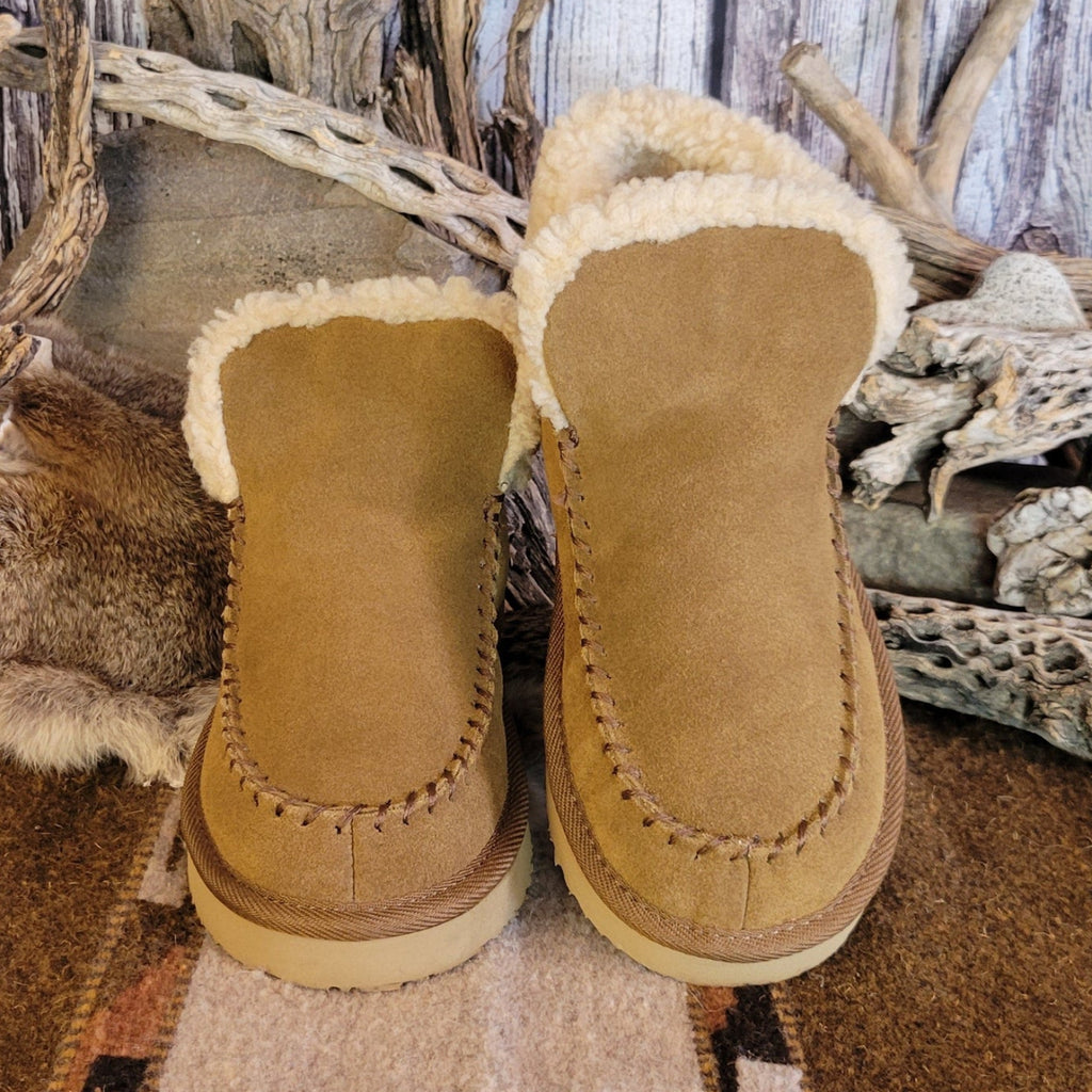 Pair of tan moccasin boots with Berber lining and EVA outsole.