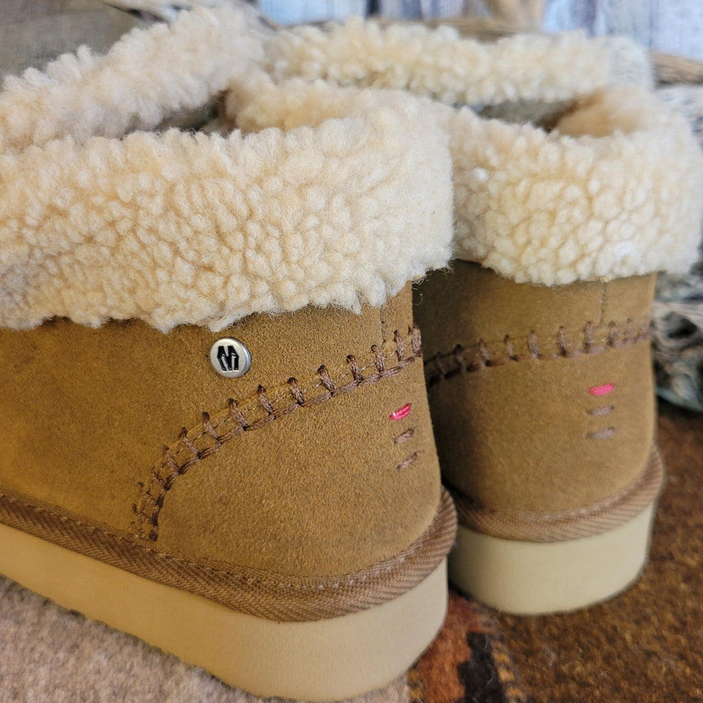Pair of tan moccasin boots with Berber lining and EVA outsole.