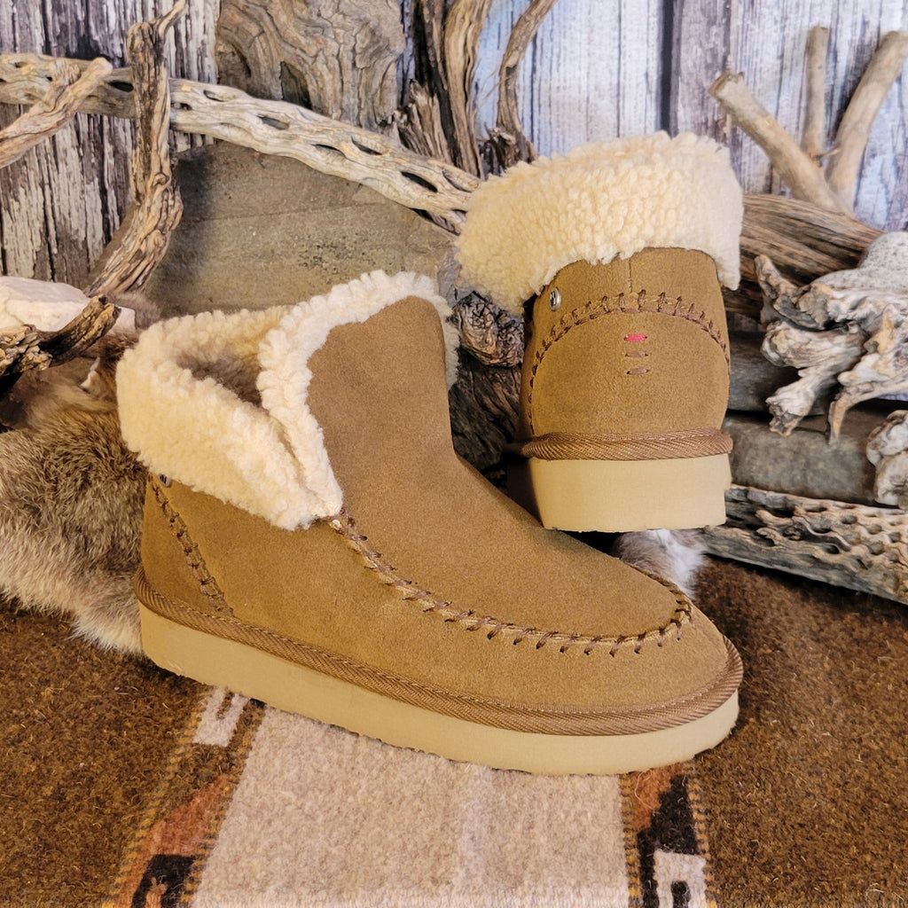 Pair of tan moccasin boots with Berber lining and EVA outsole.