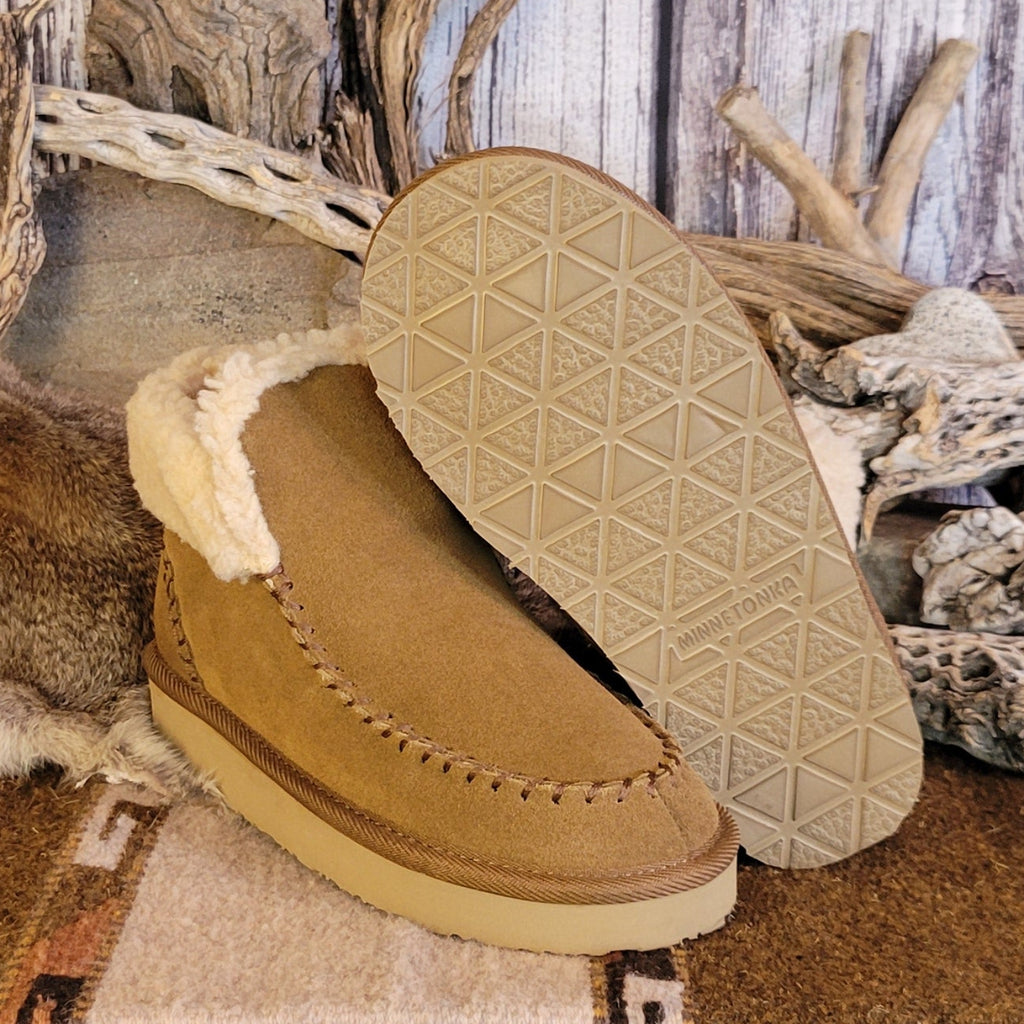 Pair of tan moccasin boots with Berber lining and EVA outsole.