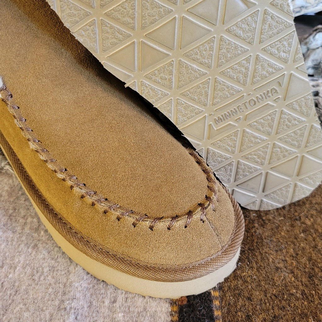 Pair of tan moccasin boots with Berber lining and EVA outsole.