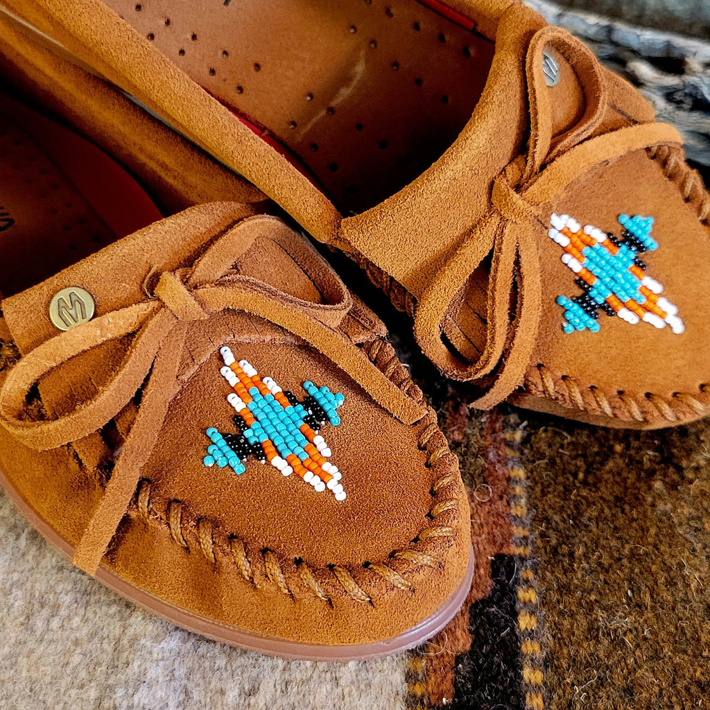Close-up of the suede lace and beaded design on the toe.