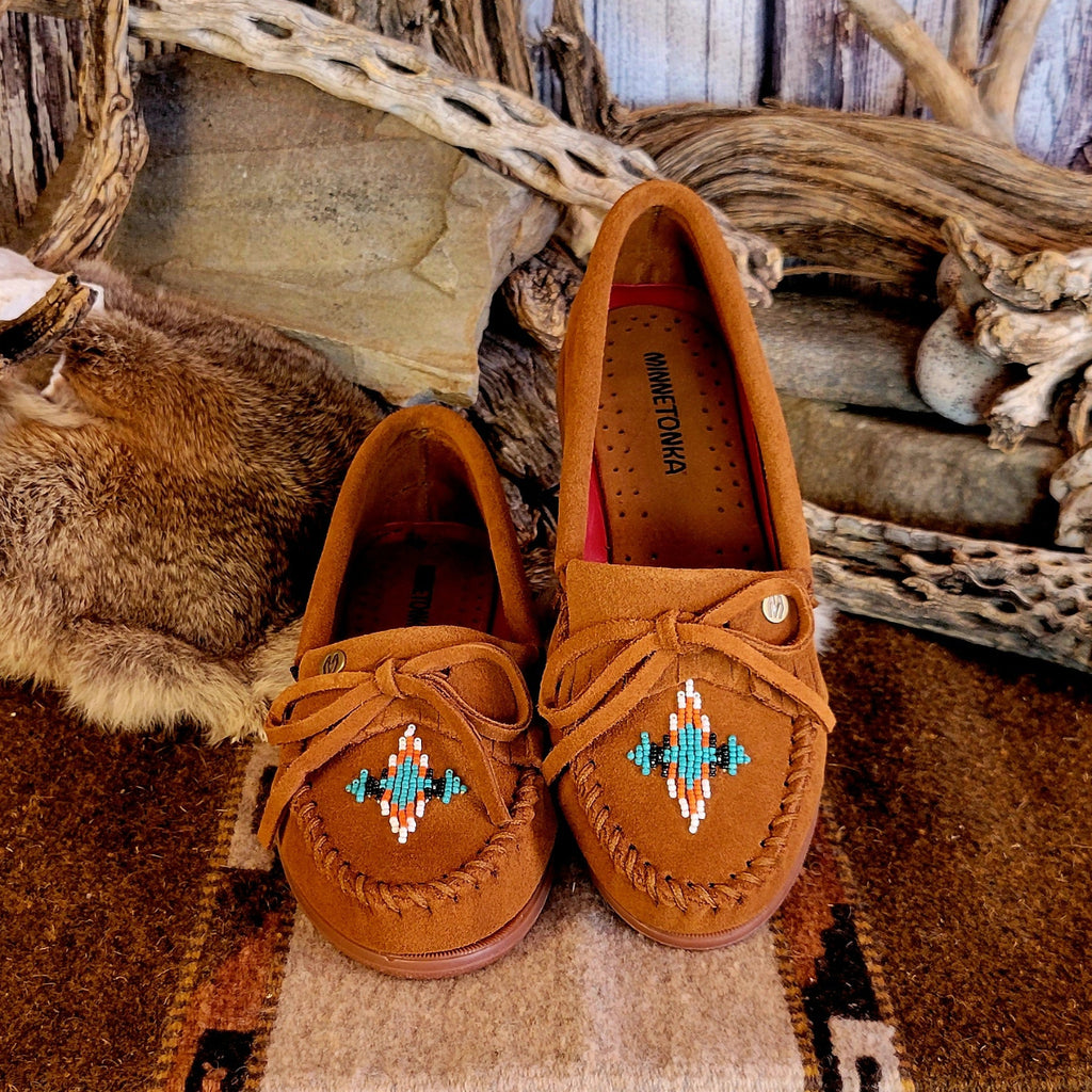 Pair of brown moccasins with decorative beading.