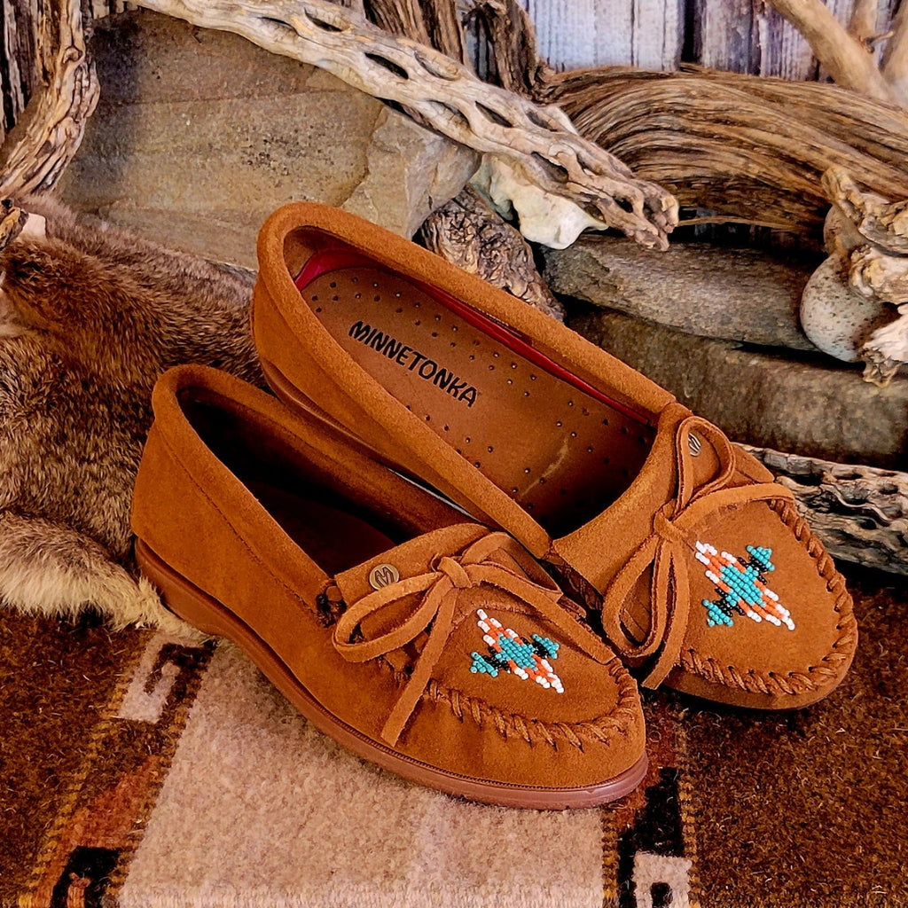 Pair of brown moccasins with decorative beading.