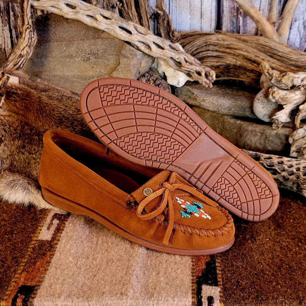 Pair of brown moccasins with decorative beading and rubber outsole.