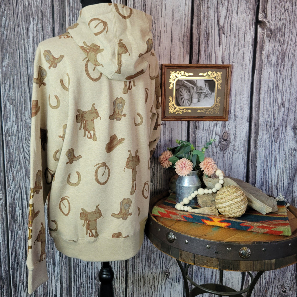 Beige hoodie with western patterns.