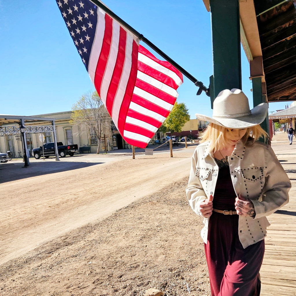 Model in White western style  jacket w/metal rivets by Cripple Creek Ranchwear-flag