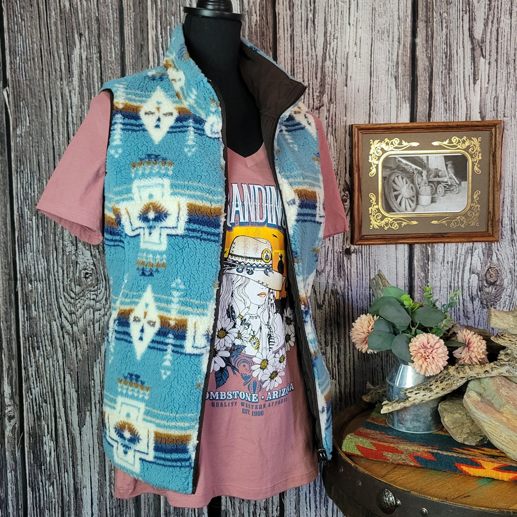 Southwestern patterned vest in fuzzy vibrant blue.