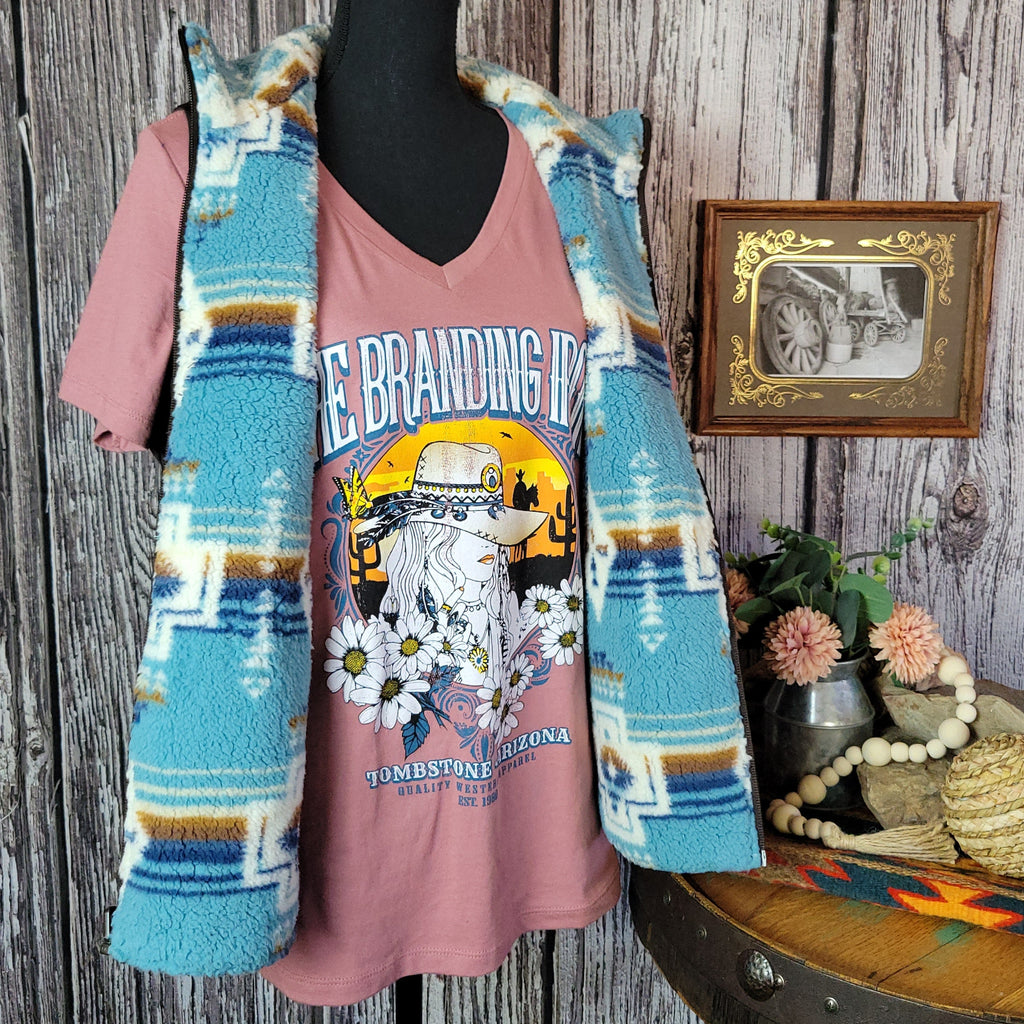 Southwestern patterned vest in fuzzy vibrant blue.