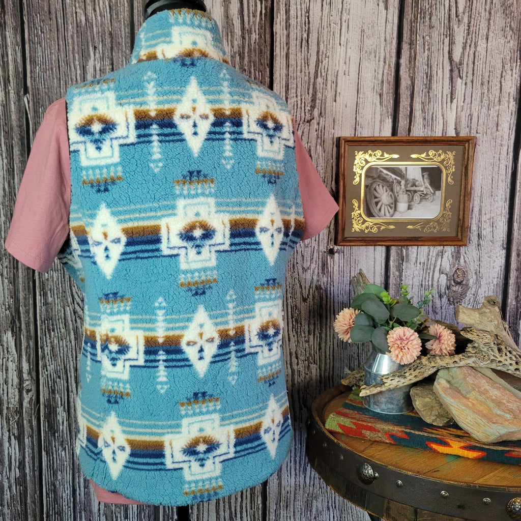 Southwestern patterned vest in fuzzy vibrant blue.