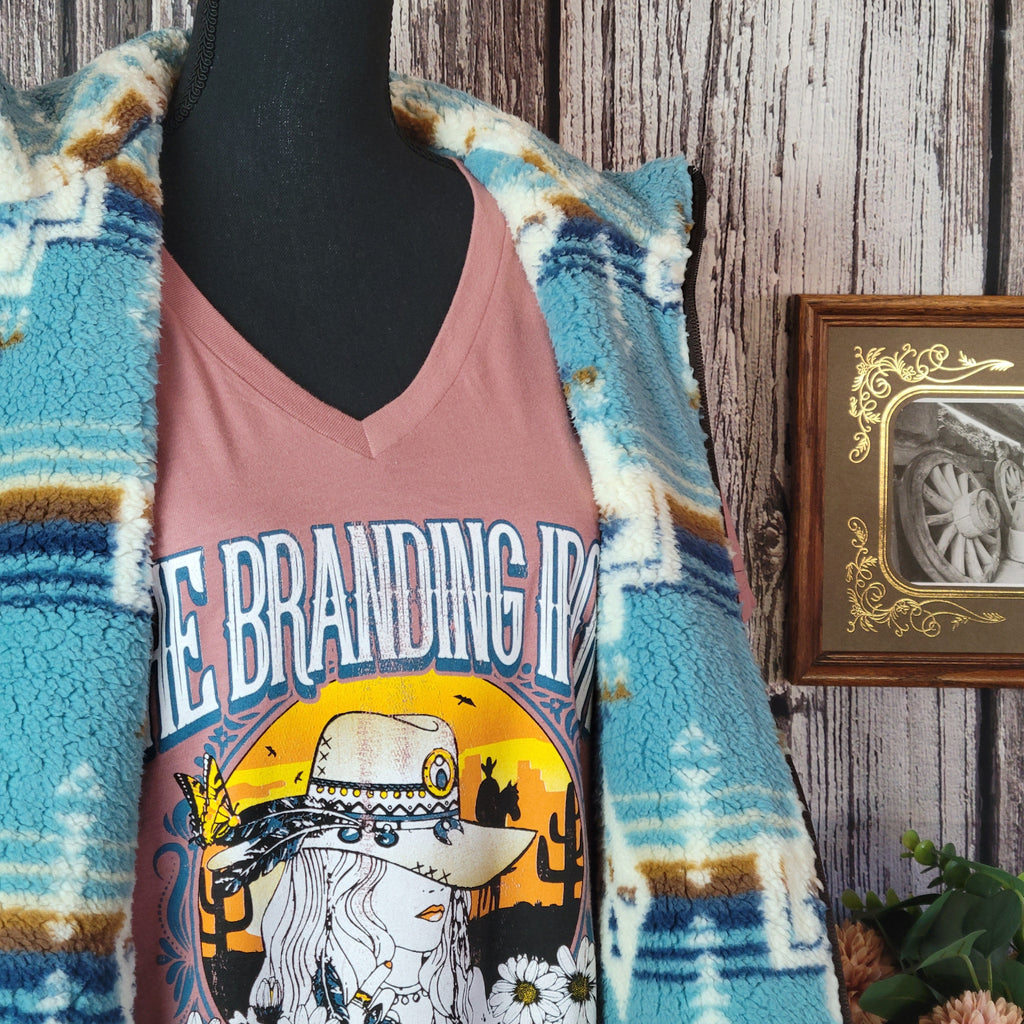 Southwestern patterned vest in fuzzy vibrant blue.