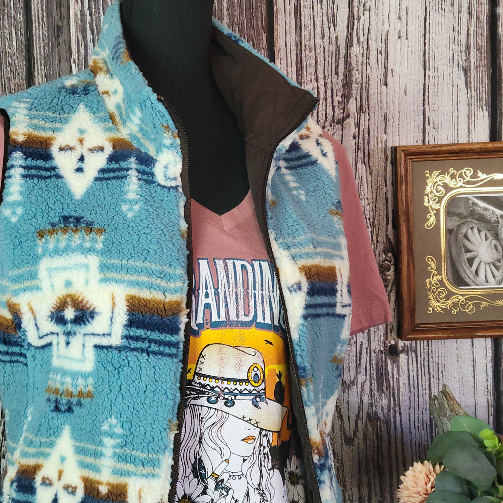 Southwestern patterned vest in fuzzy vibrant blue.