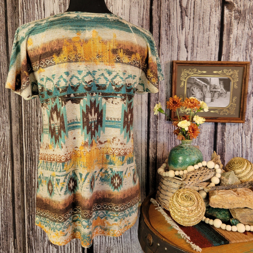 Tee with southwestern patterns and vibrant colors.