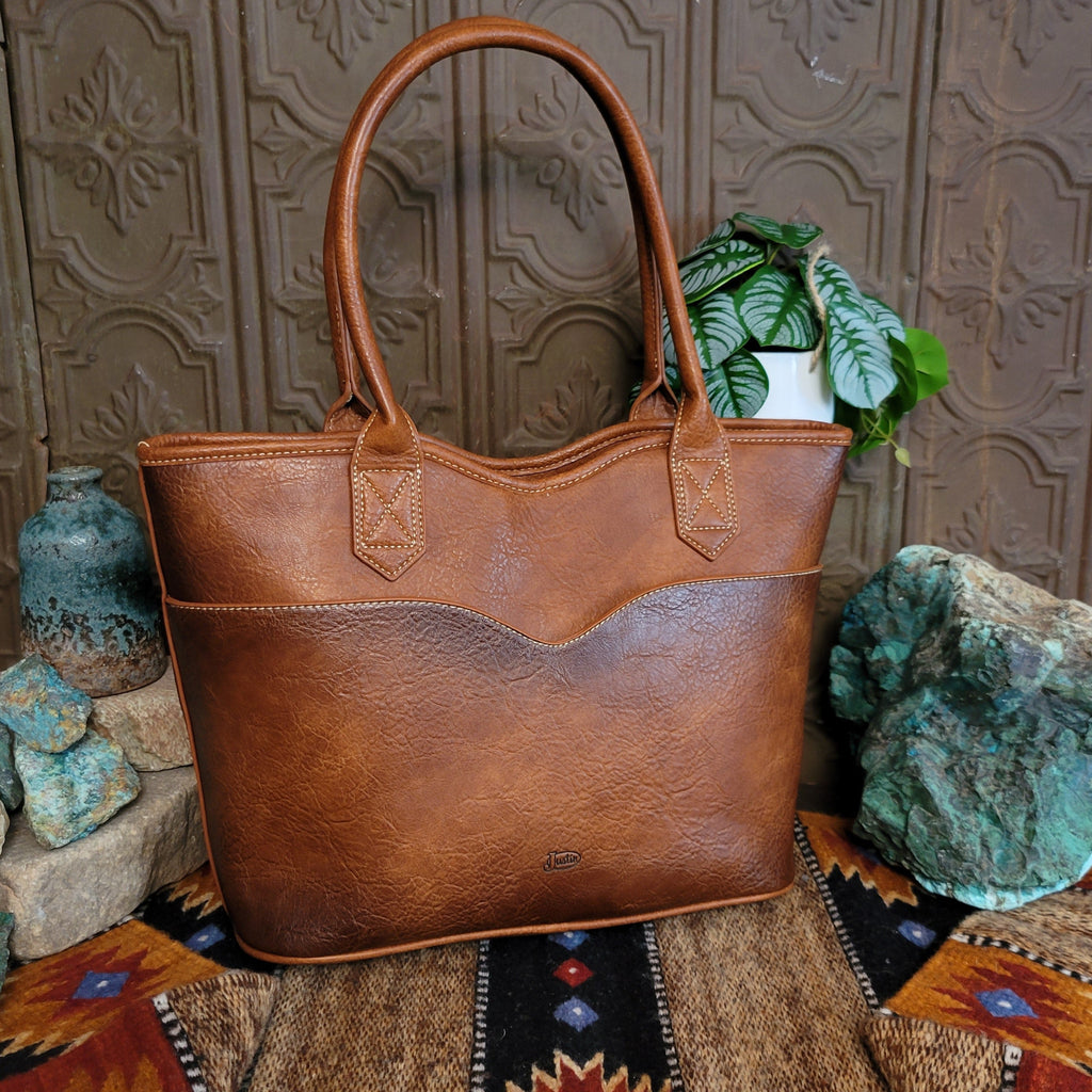 Back of the brown leather purse featuring a rustic texture and open pocket.