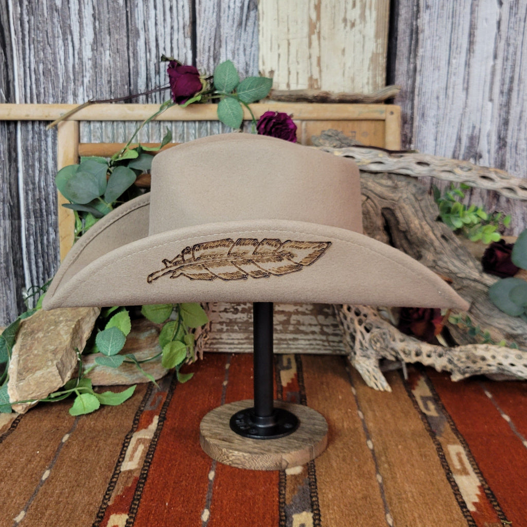 Tan wool felt hat featuring the branded feather design on the side of the brim.