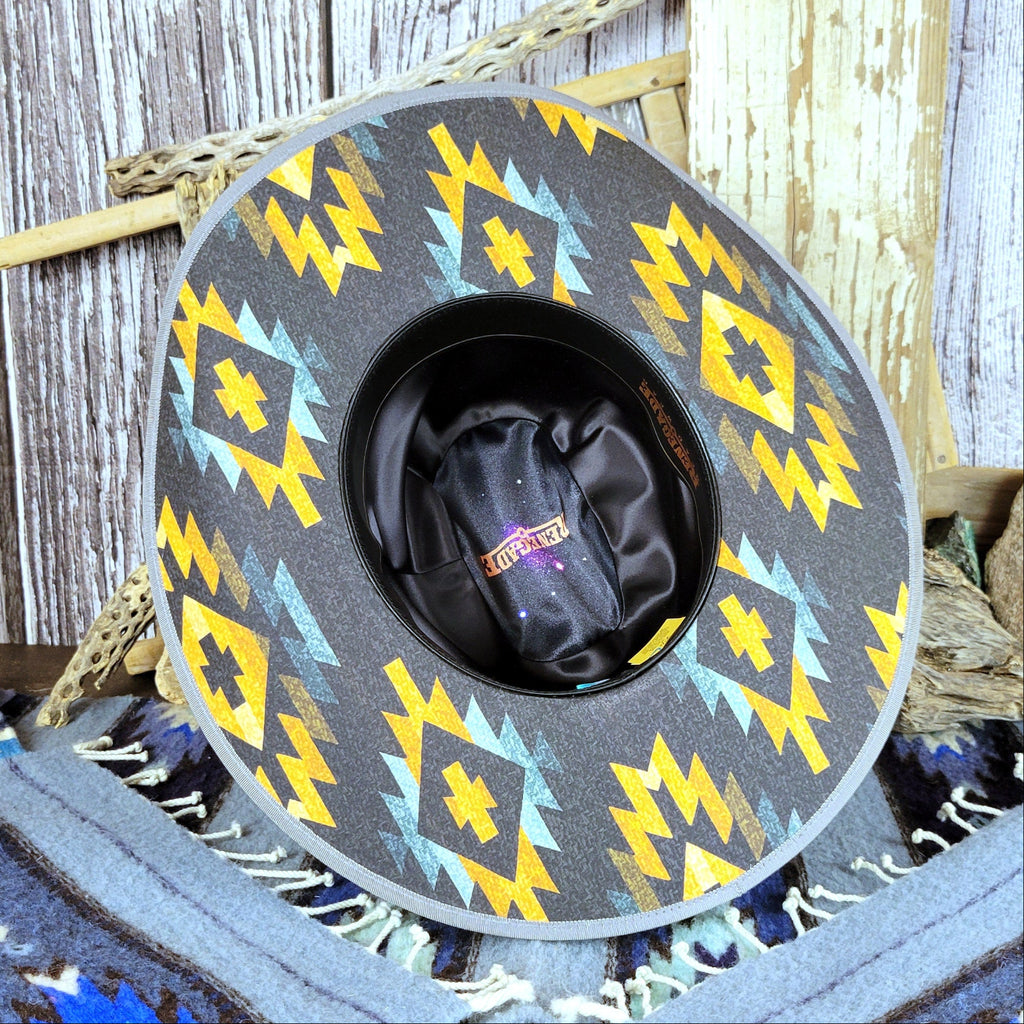 The underside of the brim is decorated with the same Aztec pattern as the hat's band.