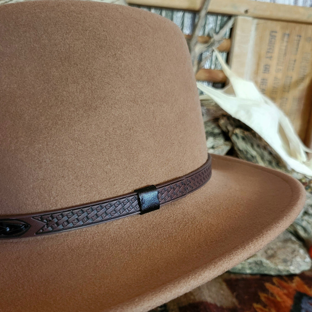A close-up of the decorative leather hat band.