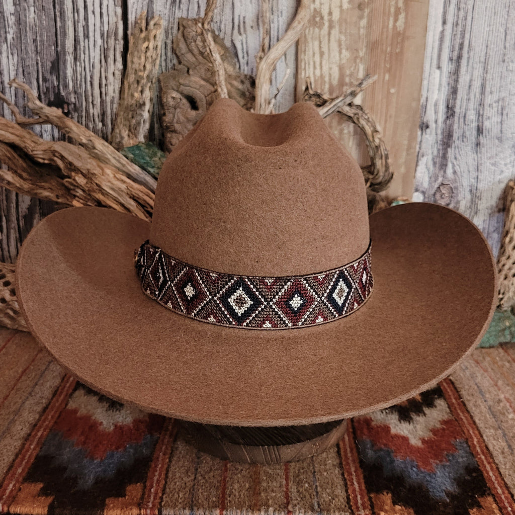 Brown wool hat with beaded decorative band.