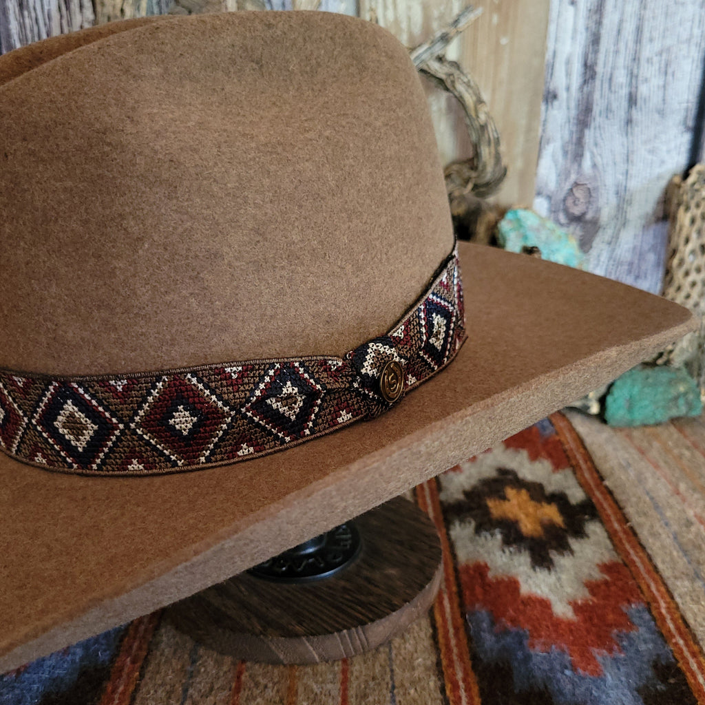 A close-up of the beaded, diamond band on the hat.