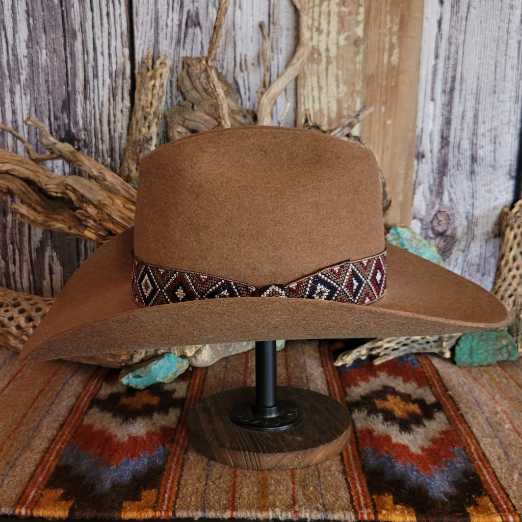 Brown wool hat with beaded decorative band.