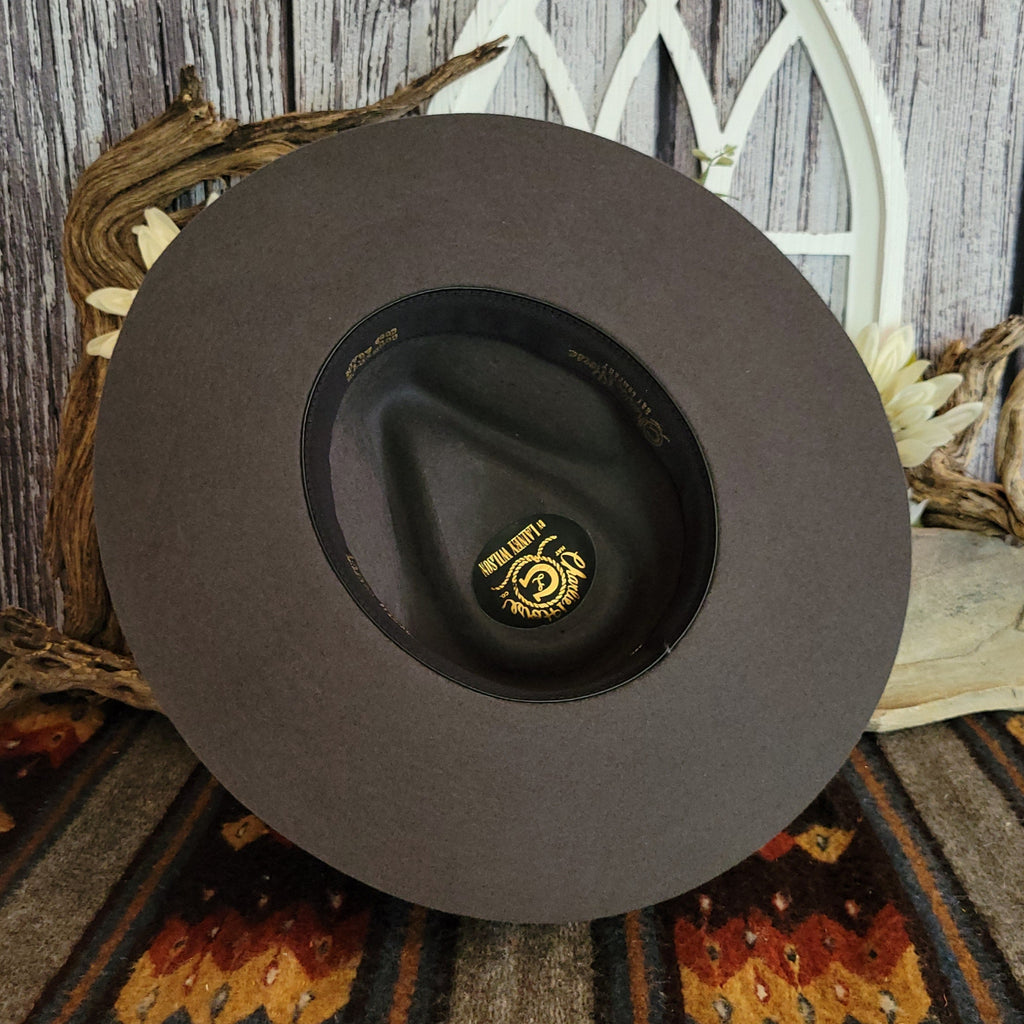 The interior has a gold logo and sweatband.
