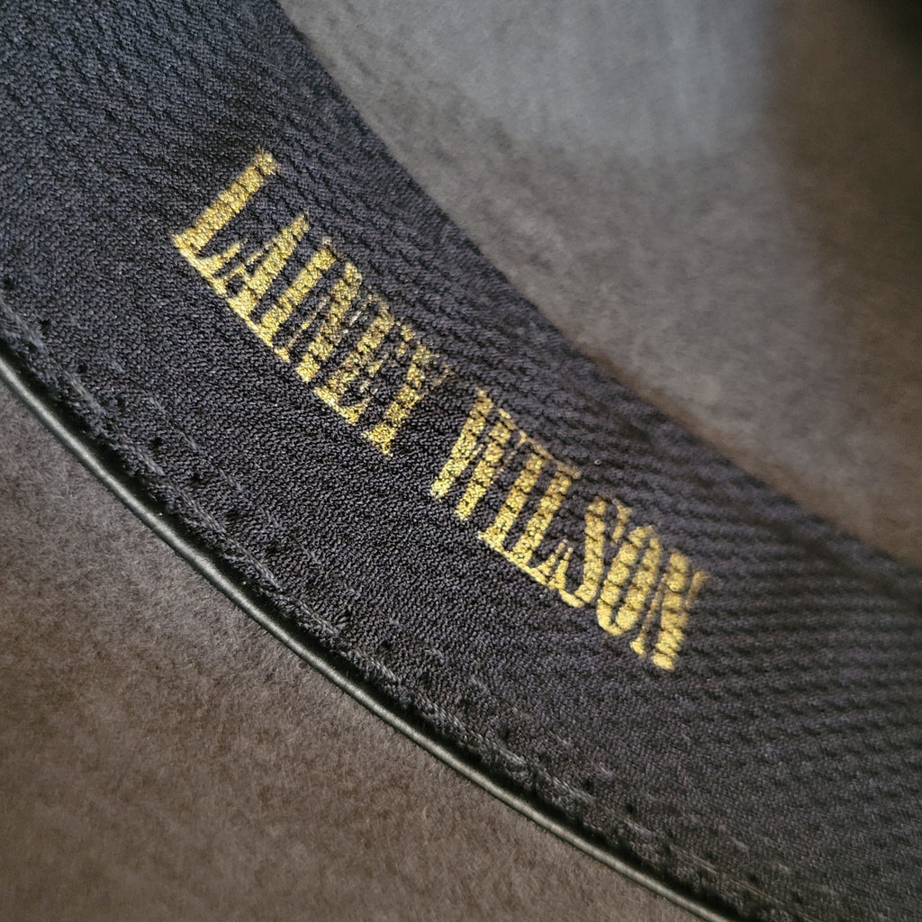 "Lainey Wilson" in gold lettering on the band.