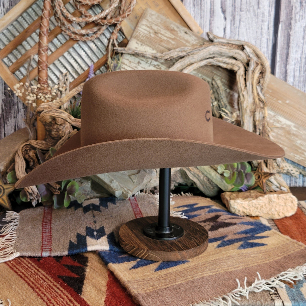 Wool cowgirl hat in the color brown with curved brim.