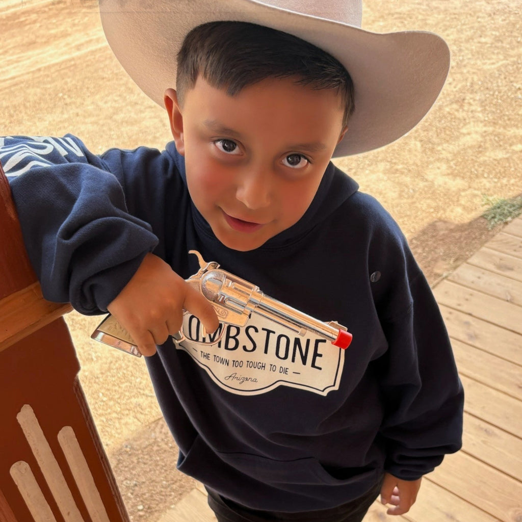 Young boys wearing a dark blue Tombstone hoody.