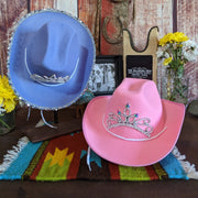 Both pink and purple western hats showcasing their tiaras.