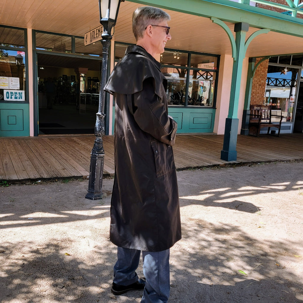 Waterproof oilskin duster with a full-length slicker design.