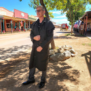 Waterproof oilskin duster with a full-length slicker design.